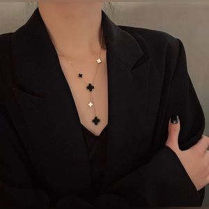 New 18k Rose Gold long 4 leaf clover stainless steel necklace.